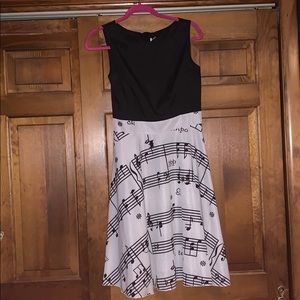 Black top sheet music bottom midi dress